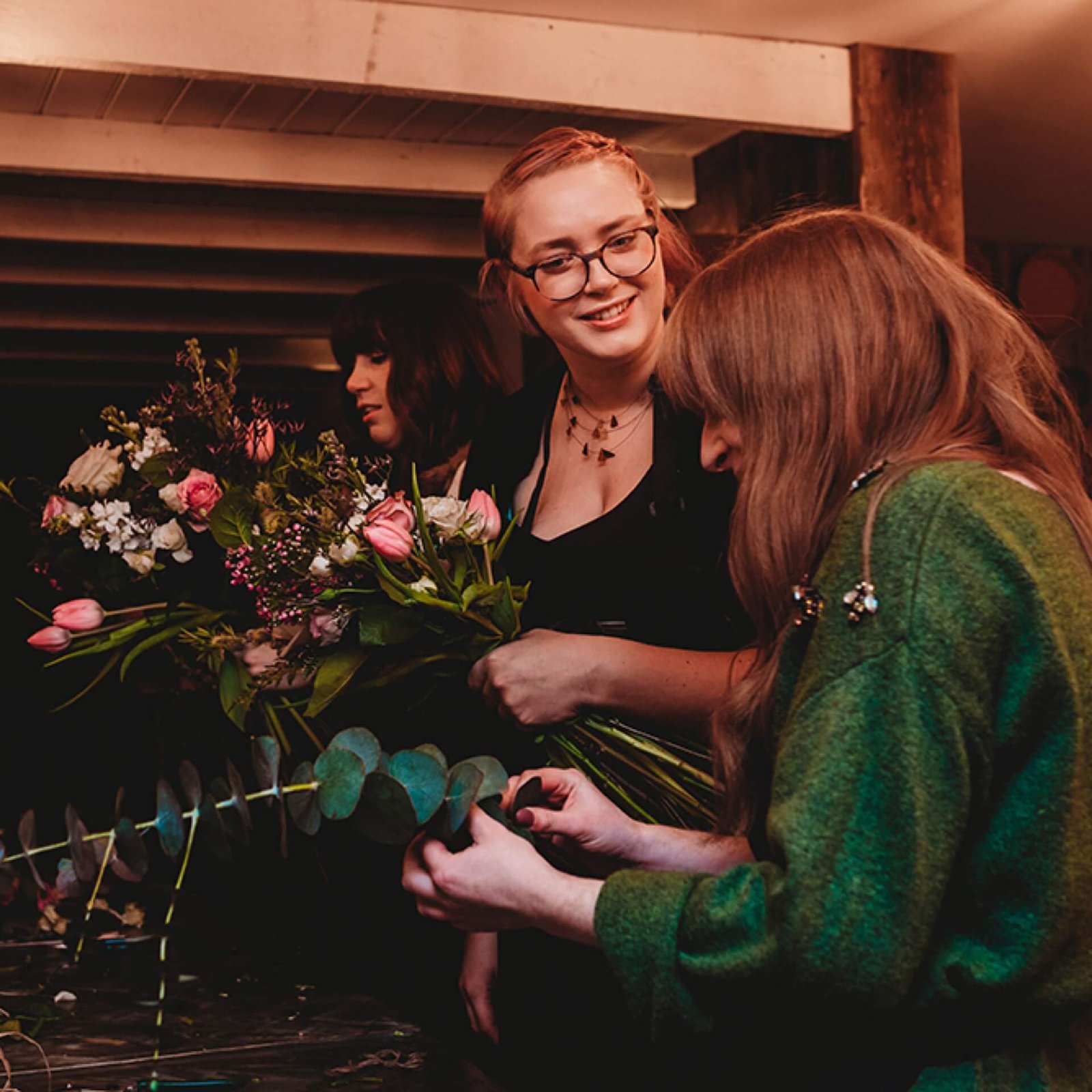 floral workshop attendee arranging a bouquet
