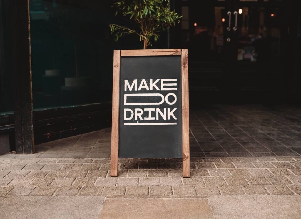 chalkboard make do drink sign outside a workshop venue